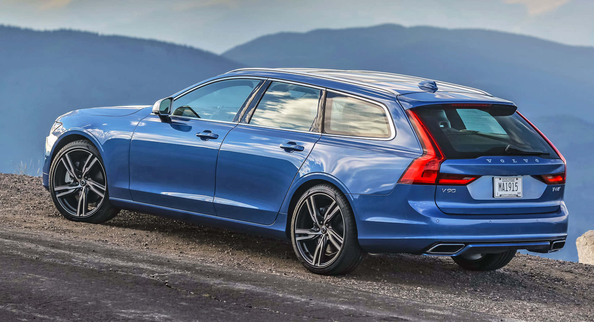 Sleek And Stylish Volvo V90 In A Picturesque Setting Wallpaper
