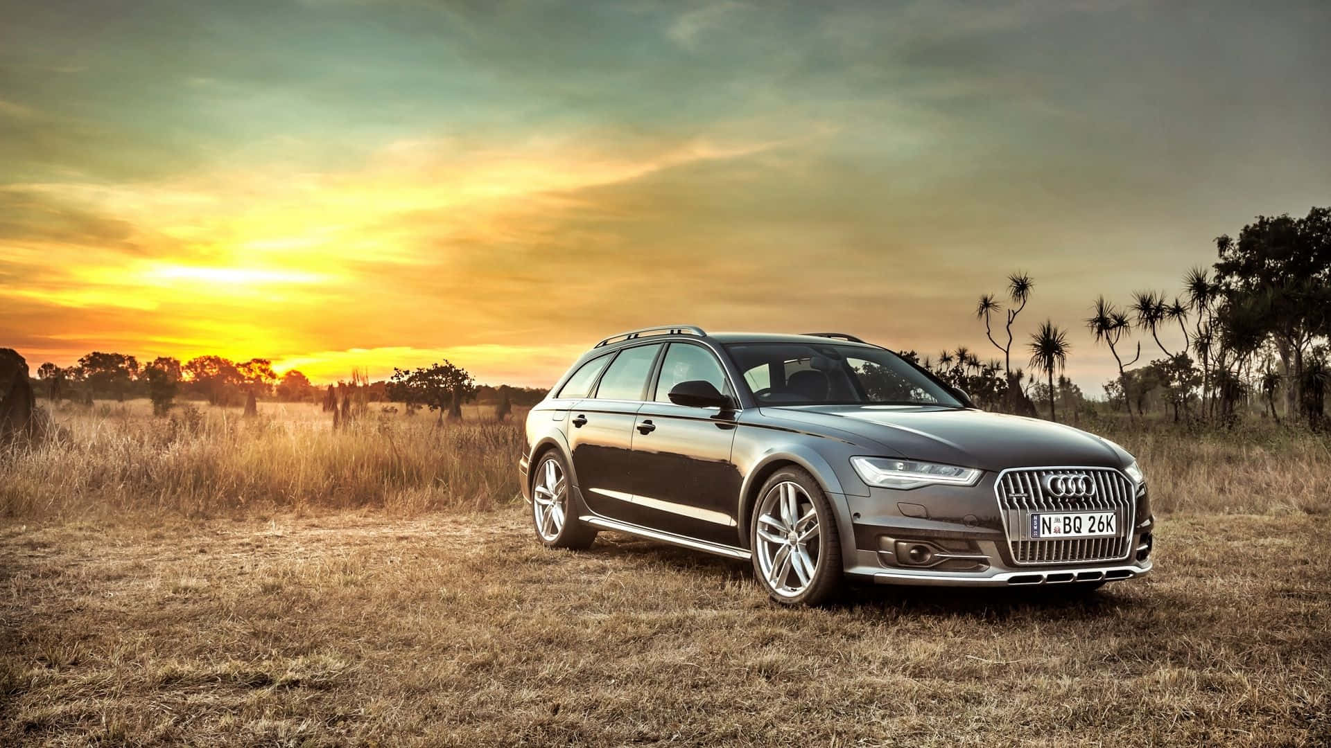 Sleek Audi S6 In Exhilarating Speed Wallpaper