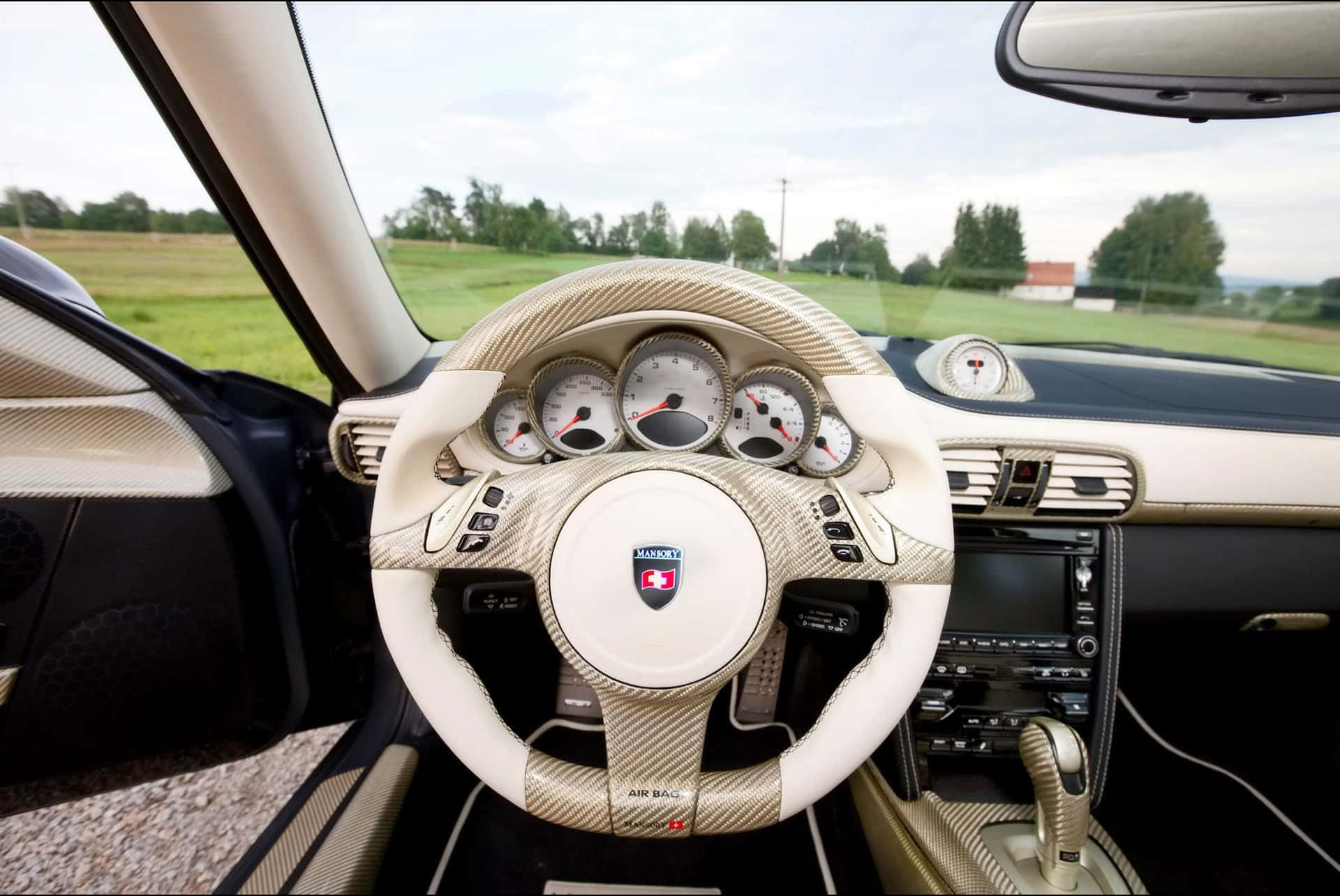 Sleek Black Car Steering Wheel Wallpaper