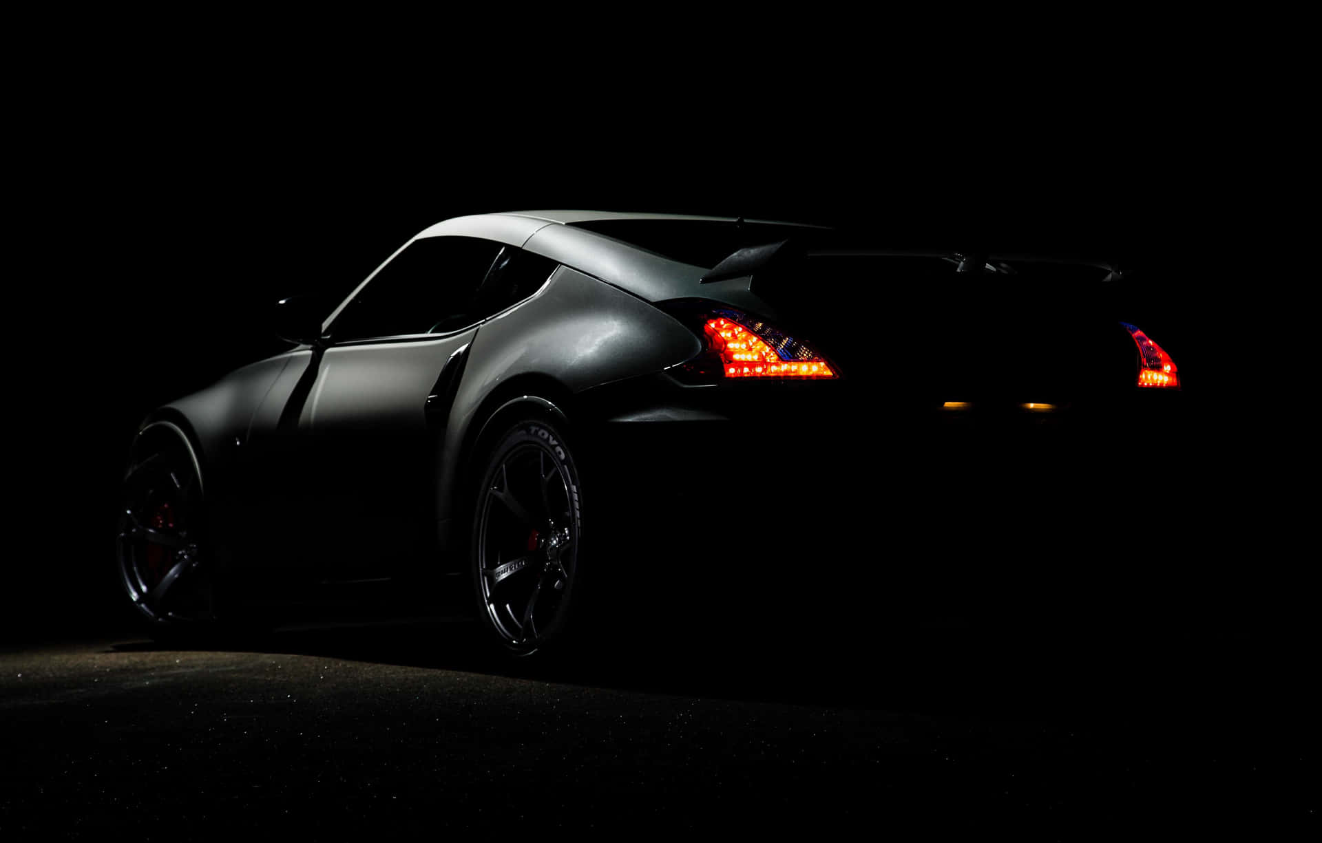 Sleek Black Sports Car Nighttime Wallpaper