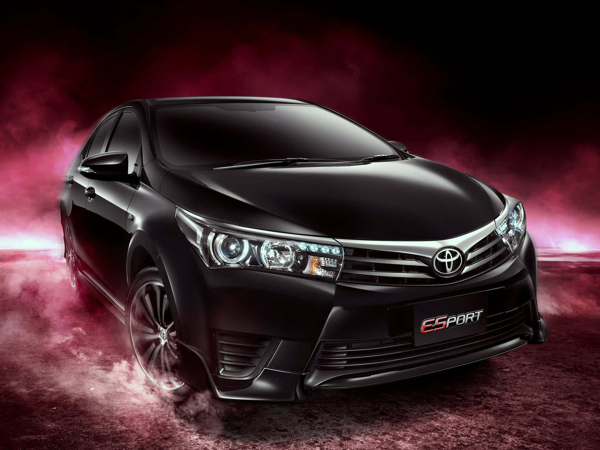 Sleek Black Toyota Corolla Ready For A Drive Wallpaper