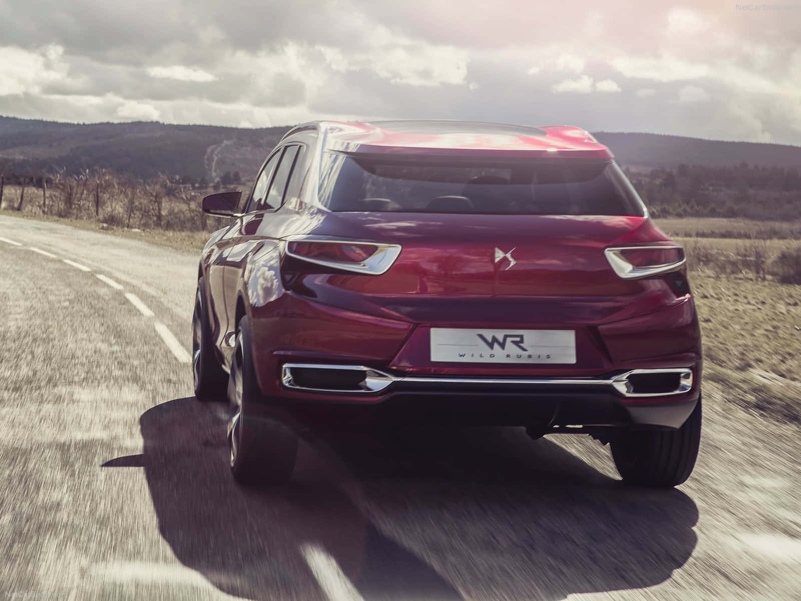 Sleek Citroen Ds Wild Rubis Gliding Down The Road. Wallpaper