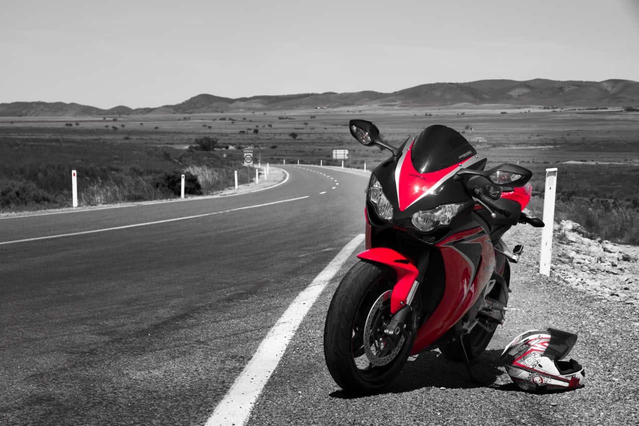 Sleek Honda Motorcycle Showcasing Ultimate Speed&Elegance Wallpaper