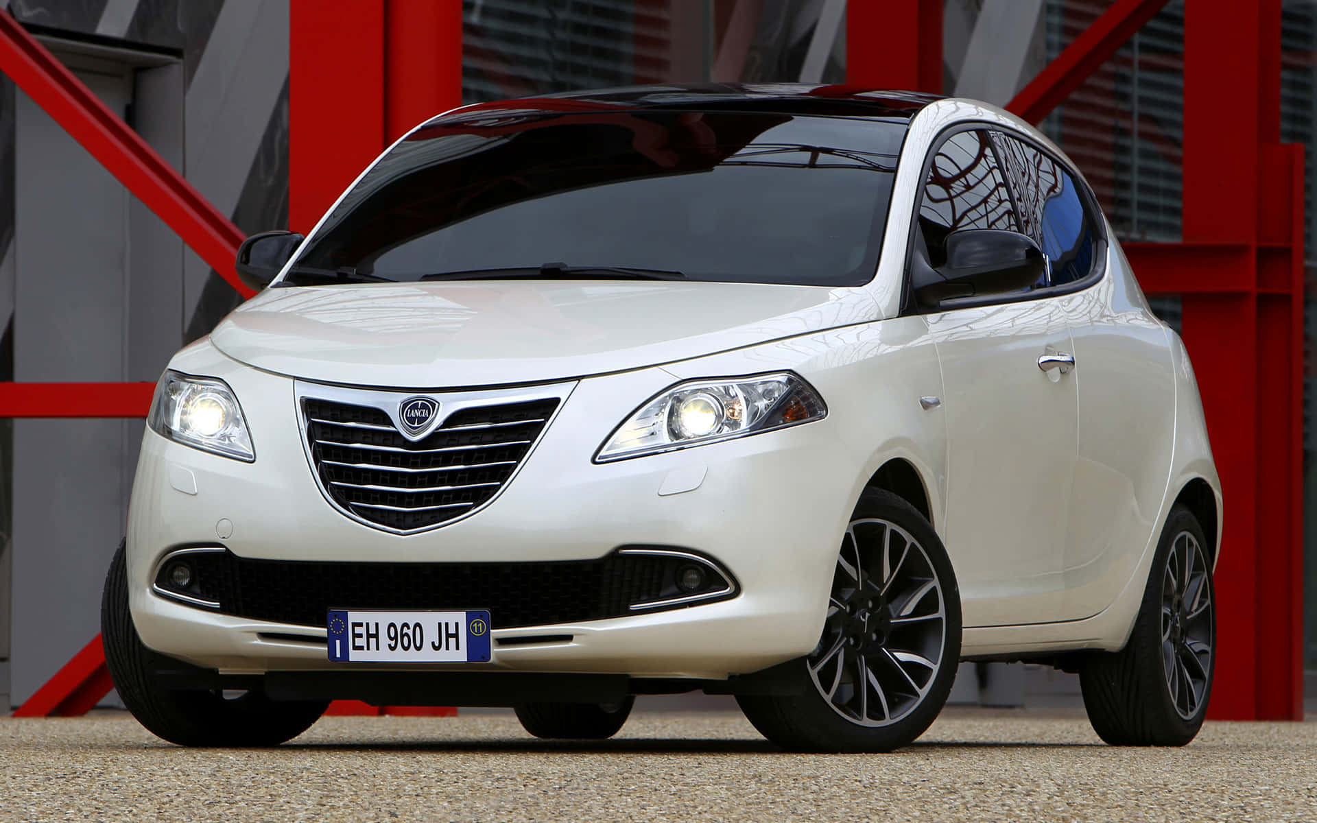 Sleek Lancia Ypsilon In An Urban Setting Wallpaper