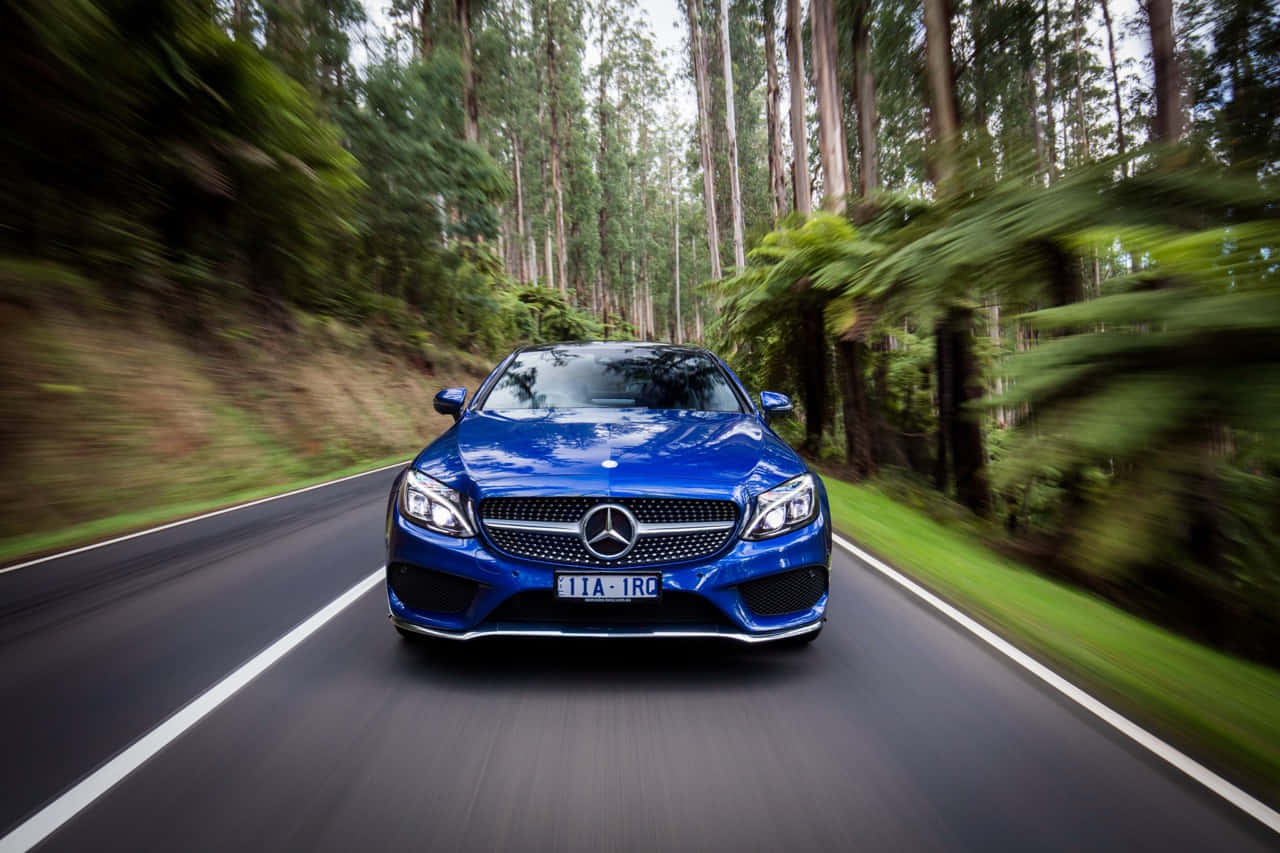 Sleek Luxury In Motion - Mercedes Benz C-class Wallpaper