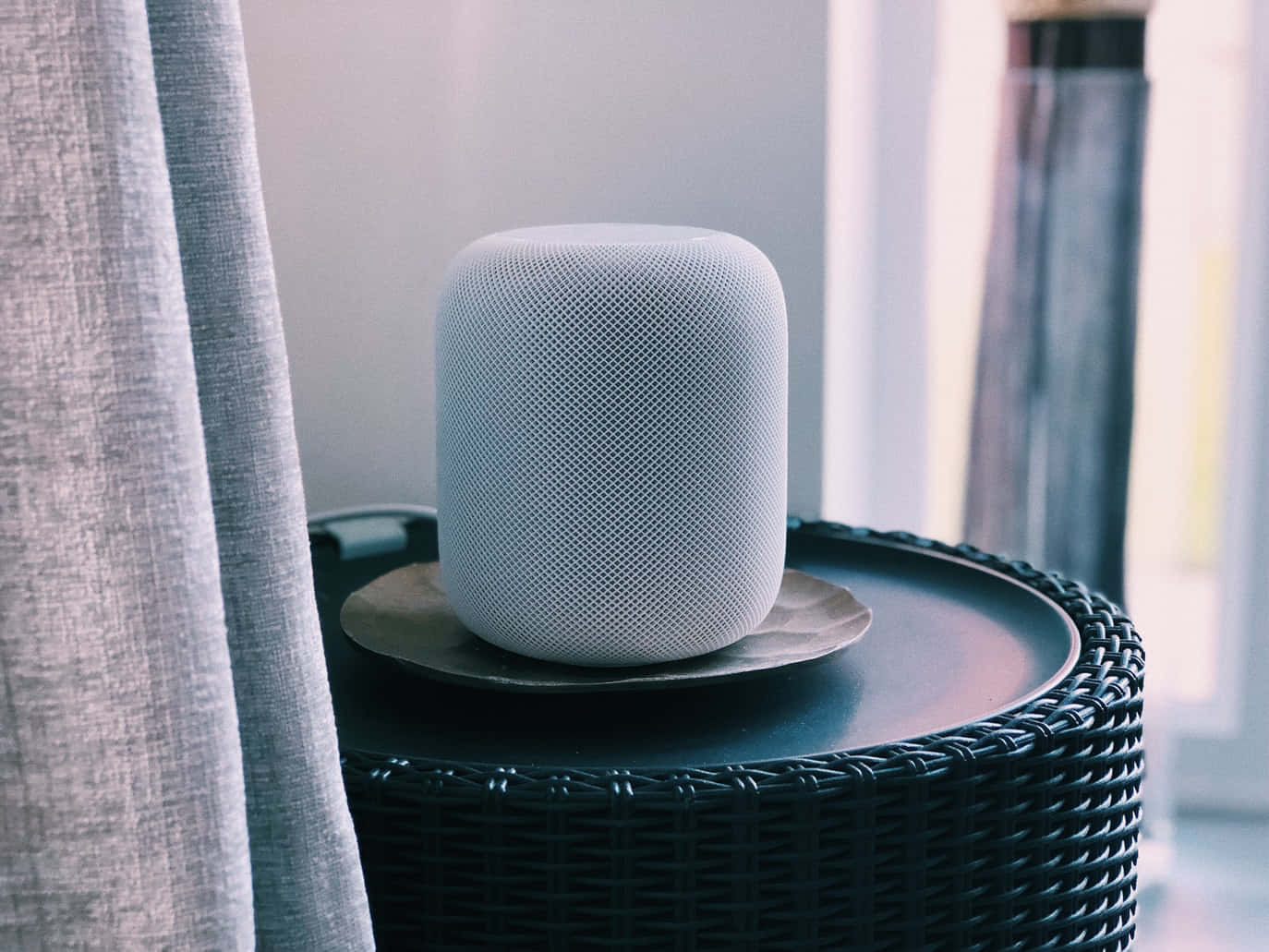 Sleek, Modern Apple Homepod On Classic Wooden Table Wallpaper