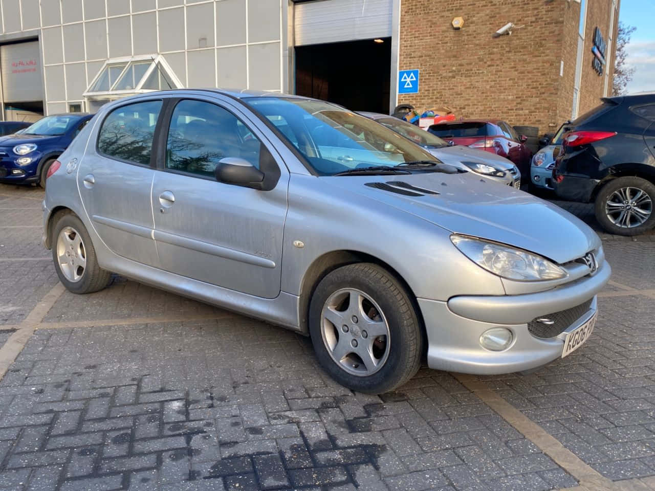 Sleek Peugeot 206 In Sunset Scenery Wallpaper