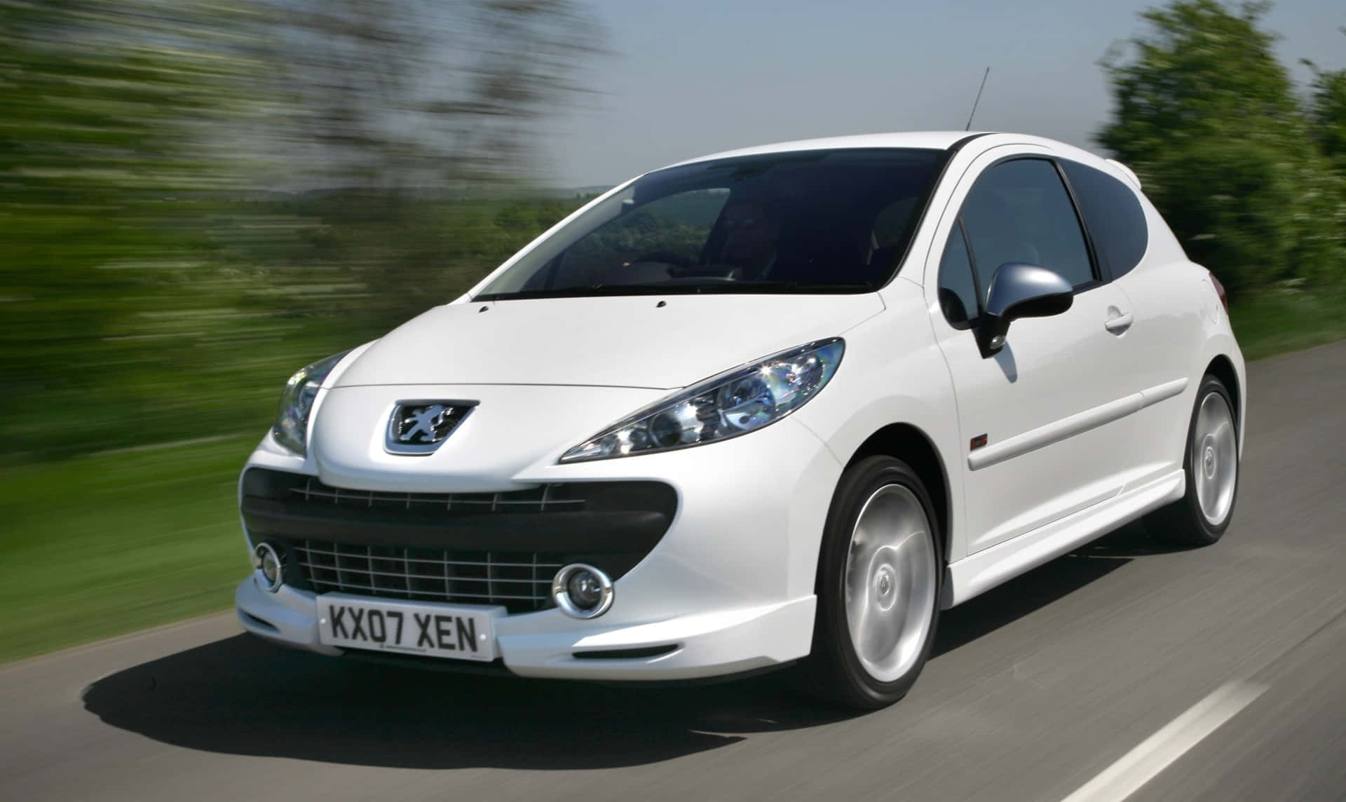 "sleek Peugeot 307 On An Open Highway" Wallpaper