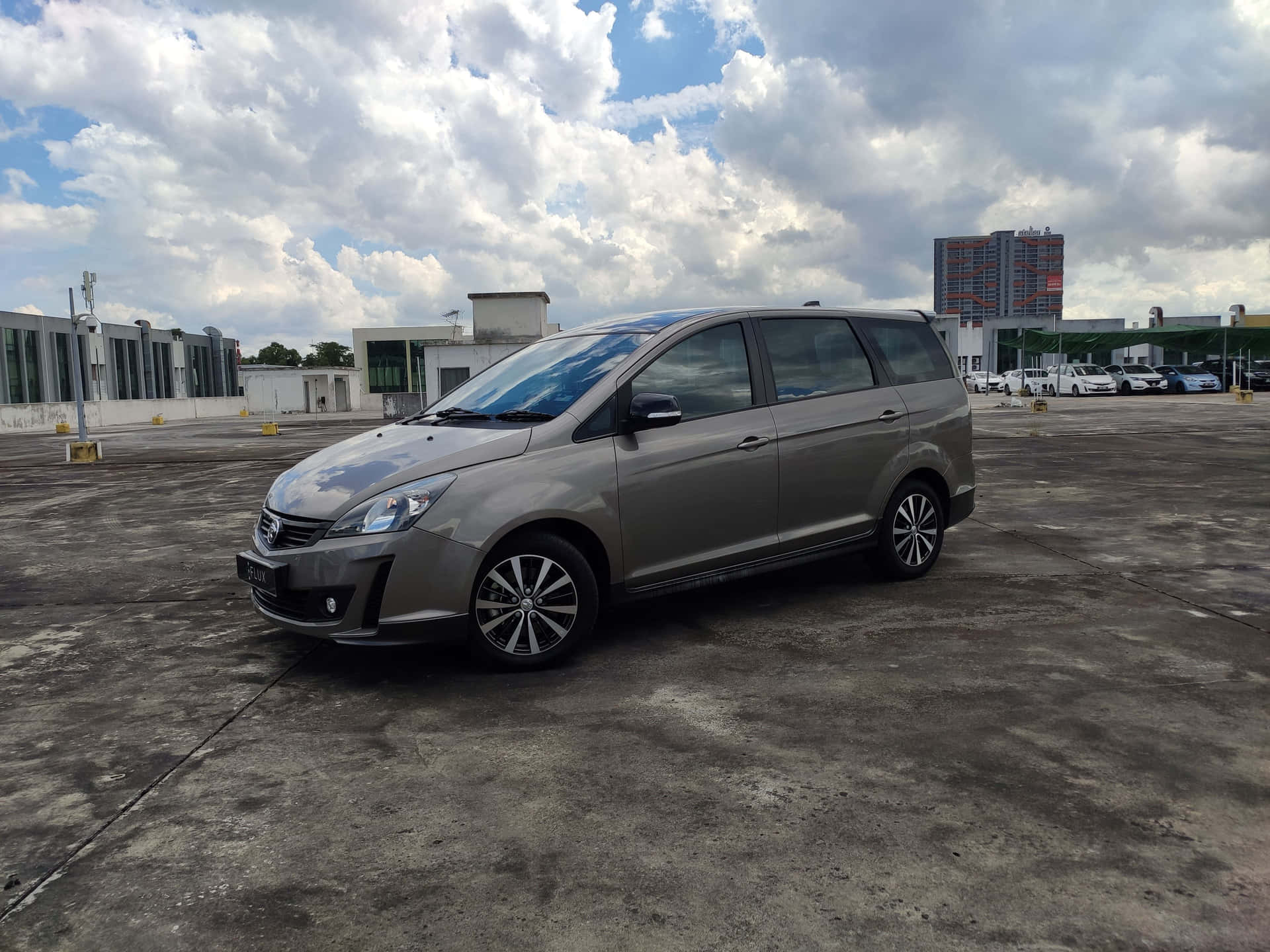 Sleek Proton Exora Cruising On The Open Road Wallpaper