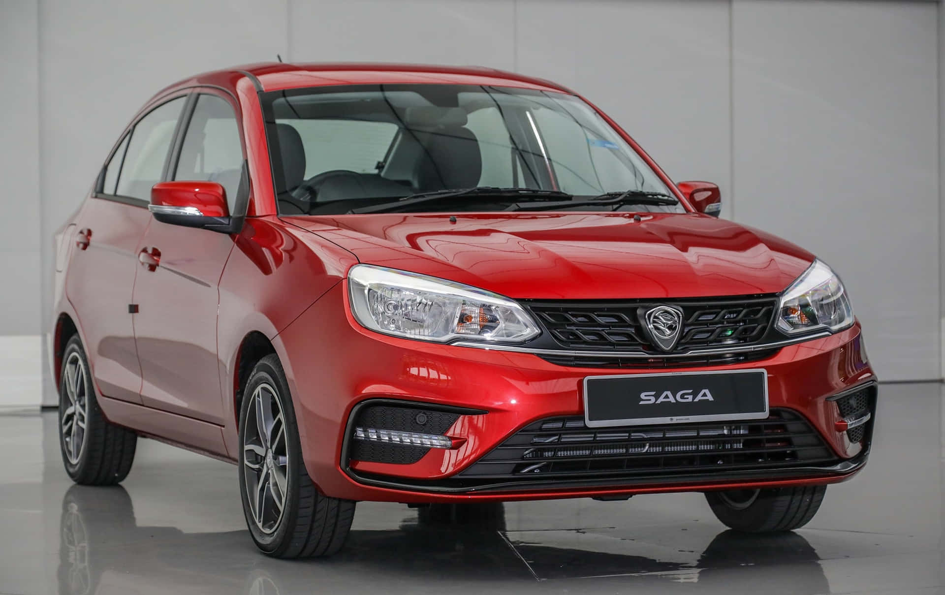 Sleek Proton Saga In Dynamic Red Wallpaper