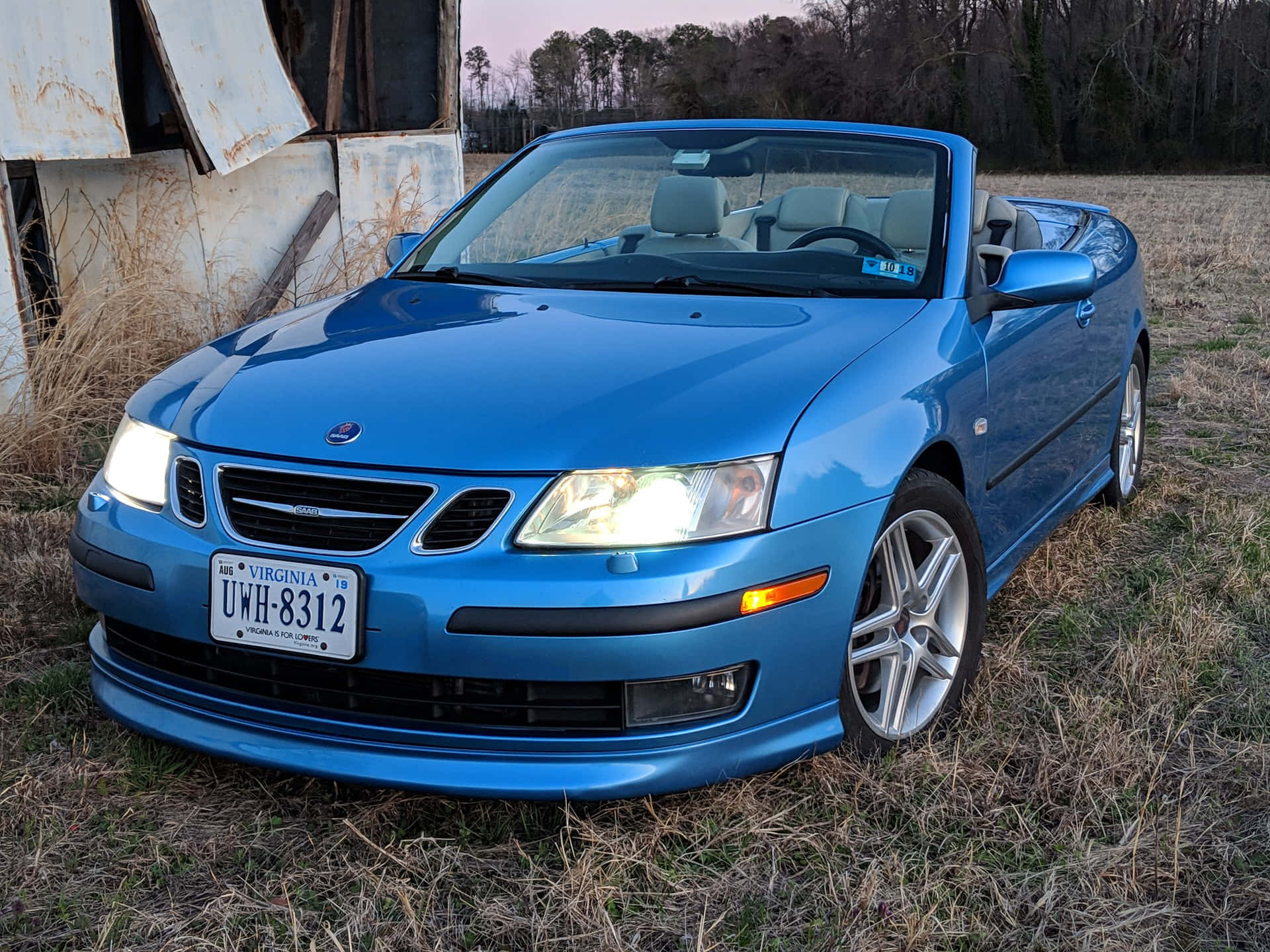 Sleek Saab 9-3 In Vibrant Cityscape Wallpaper