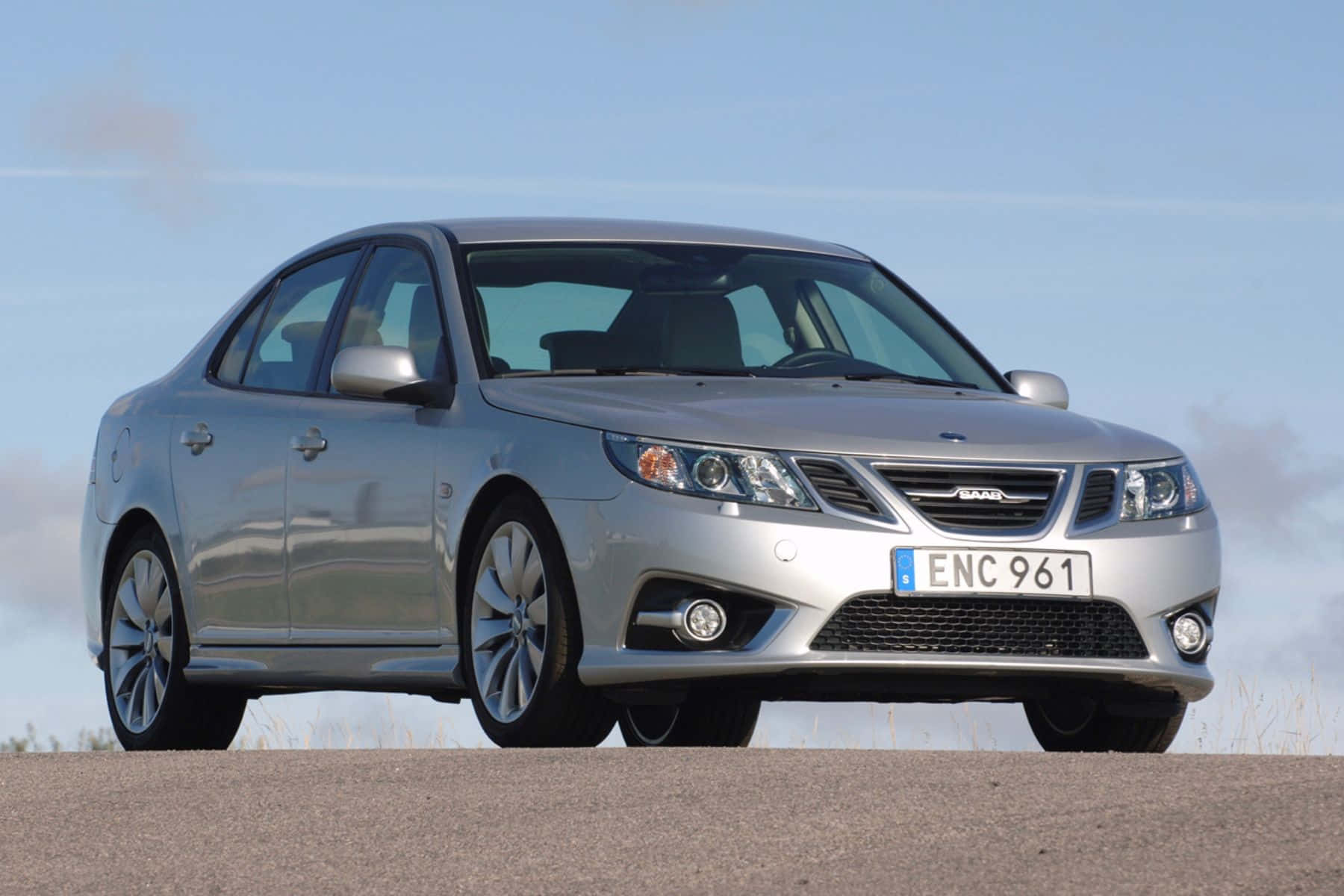 Sleek Saab 9-3 Under Blue Sky Wallpaper