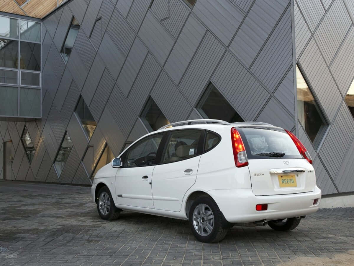 Sleek Silver Daewoo Tacuma Under The Bright Sky Wallpaper