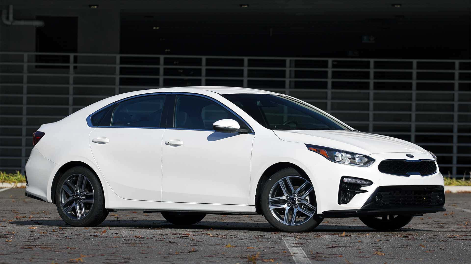 Sleek Silver Kia Forte In An Urban Environment Wallpaper