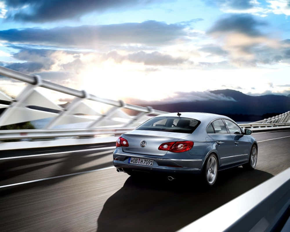 Sleek Silver Volkswagen Passat Cc On A Scenic Drive Wallpaper