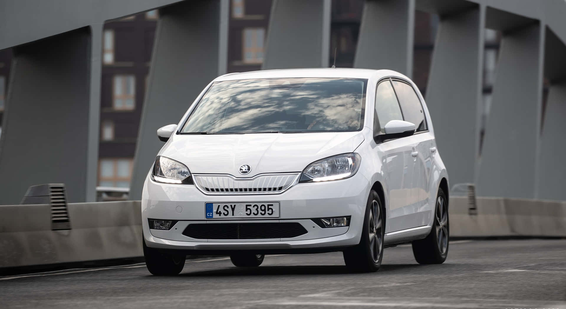 Sleek Skoda Citigo In Urban Landscape Wallpaper