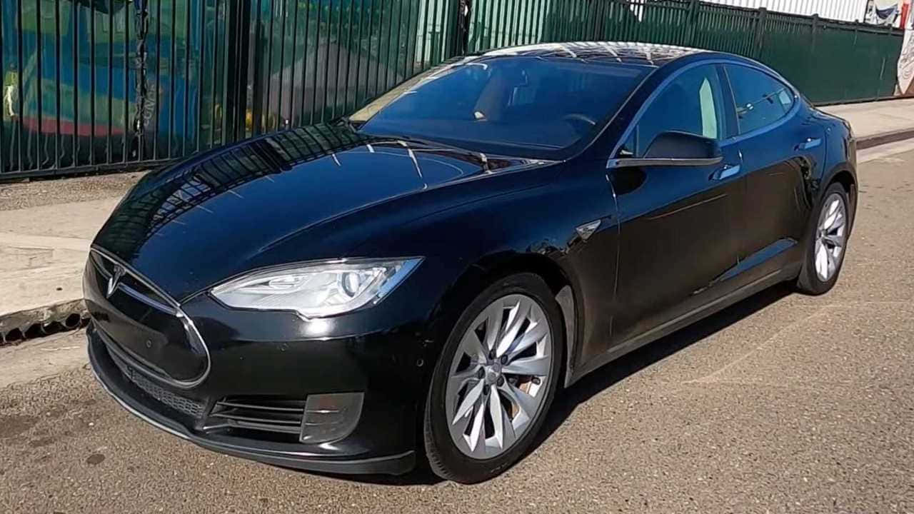 Sleek Tesla Model S On The Road Wallpaper