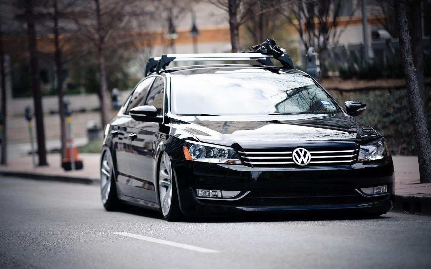 Sleek Volkswagen Passat Cc Cruising On Open Road Wallpaper