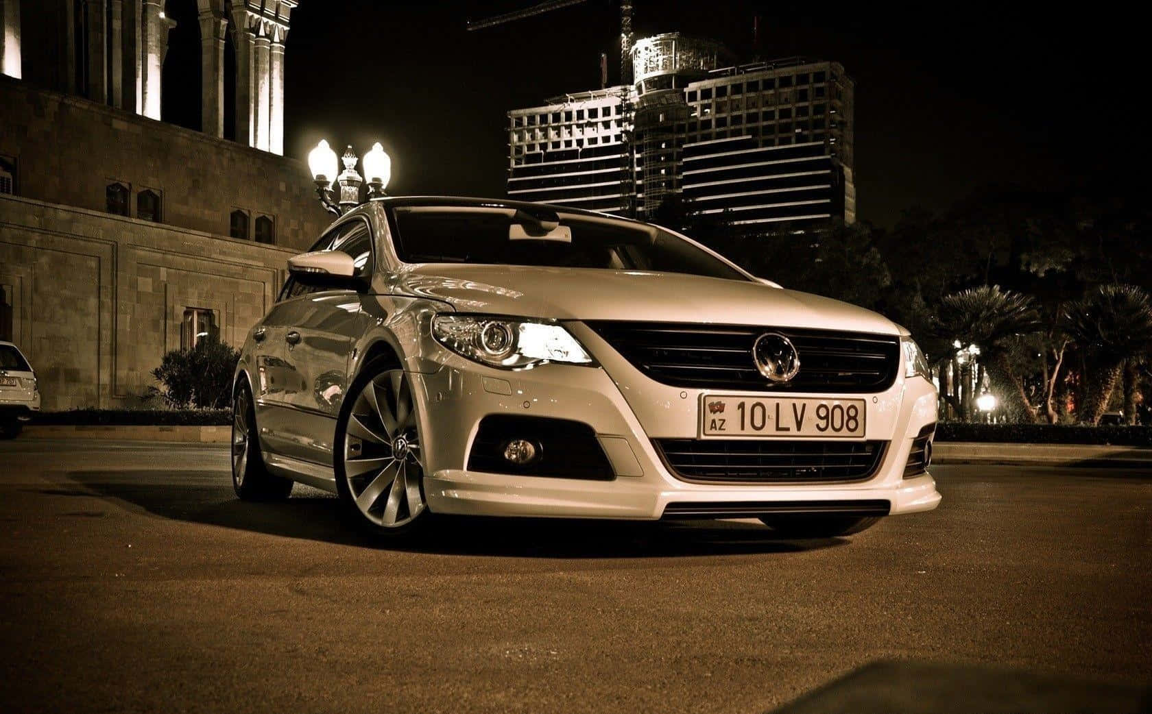 Sleek Volkswagen Passat Cc In Motion Wallpaper