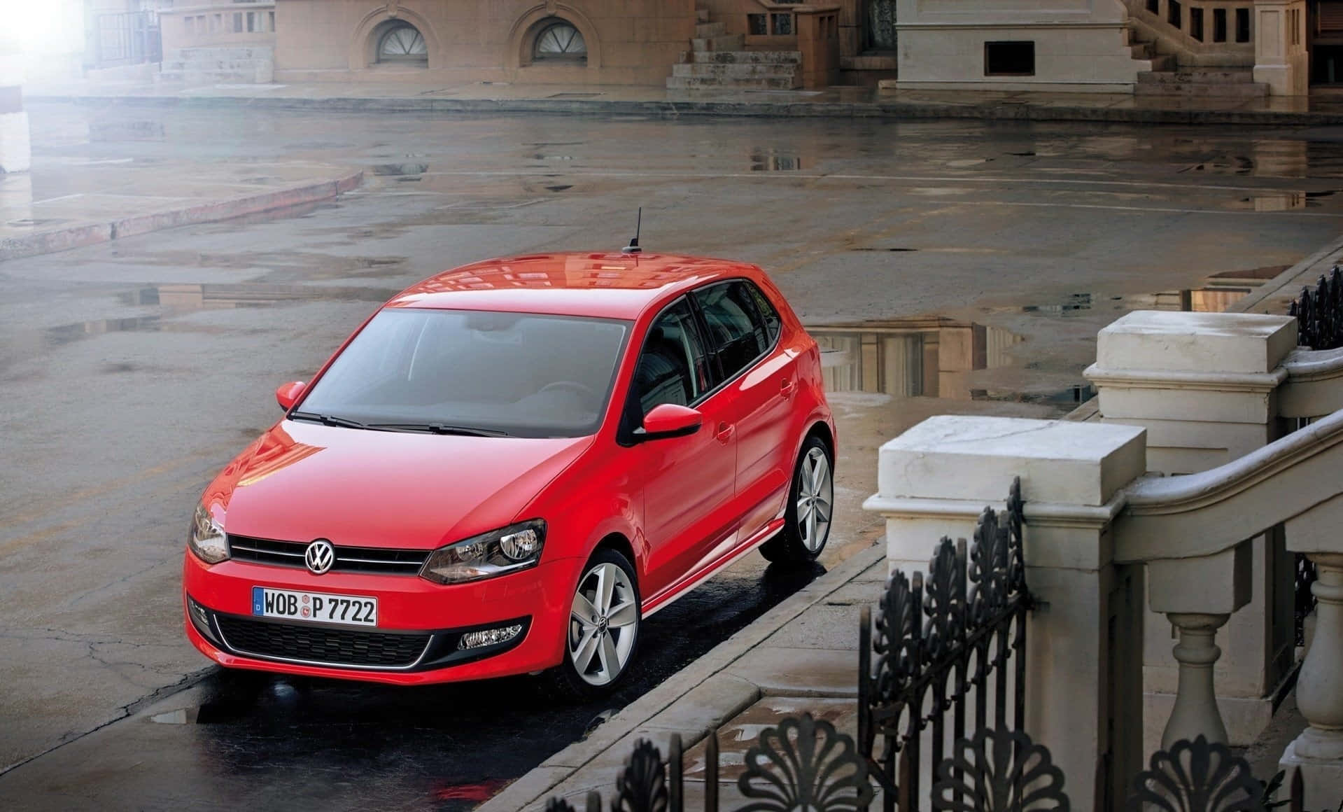 Sleek Volkswagen Polo In Vibrant Red Wallpaper