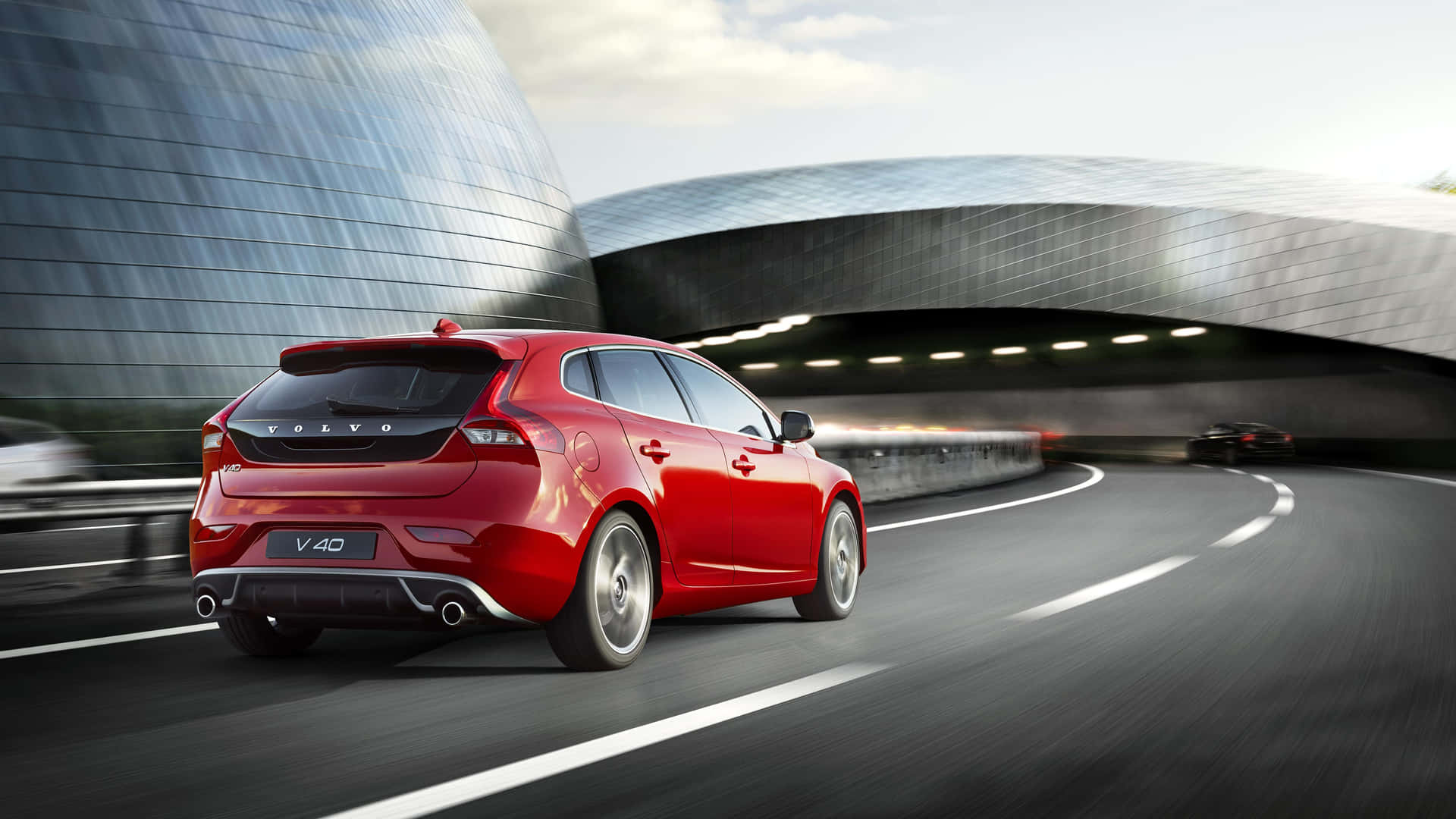 Sleek Volvo V40 In Motion Wallpaper