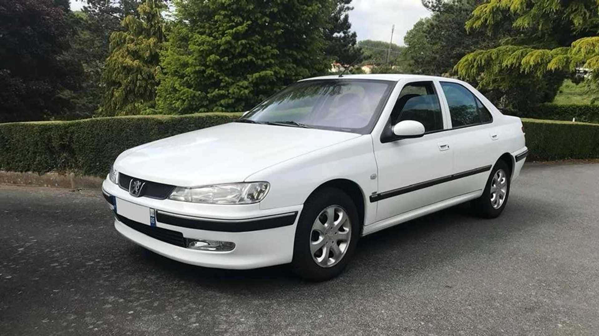 Sleek White Peugeot 406 In Motion Wallpaper