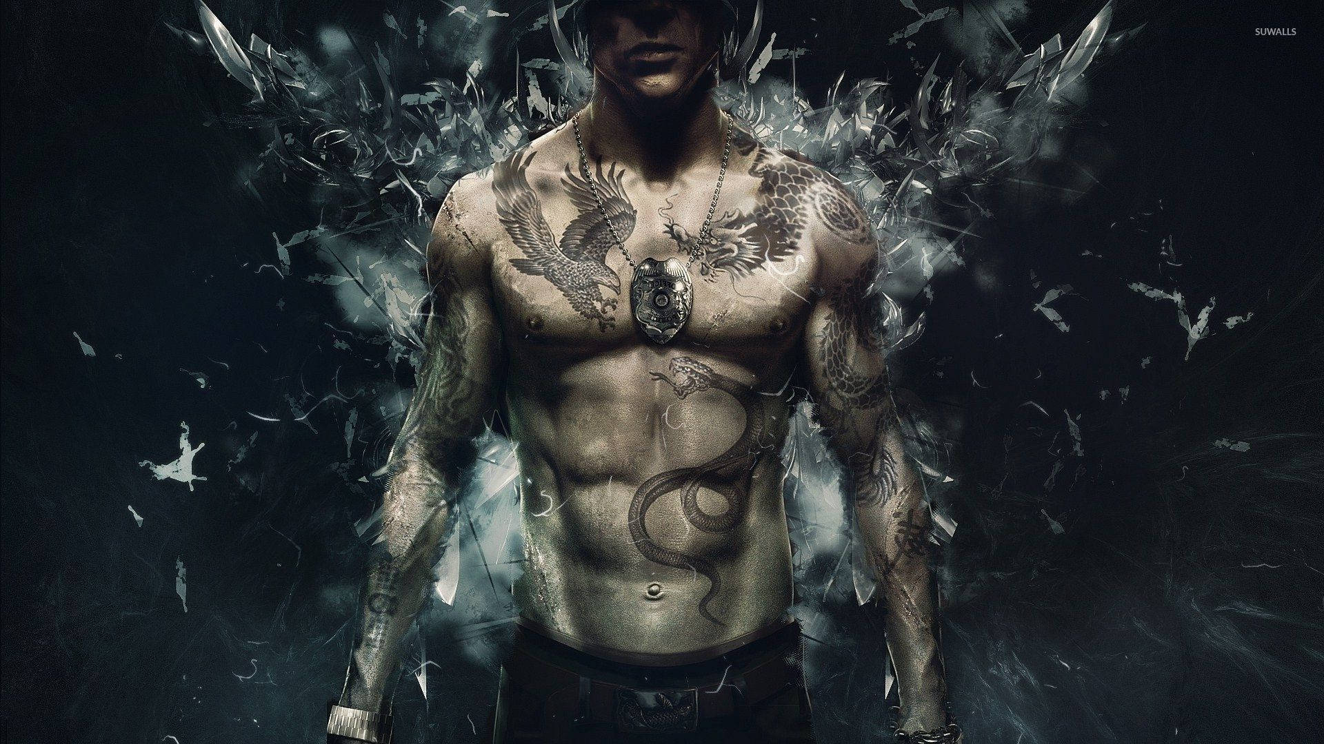 A Man With Tattoos Standing In Front Of A Black Background Wallpaper