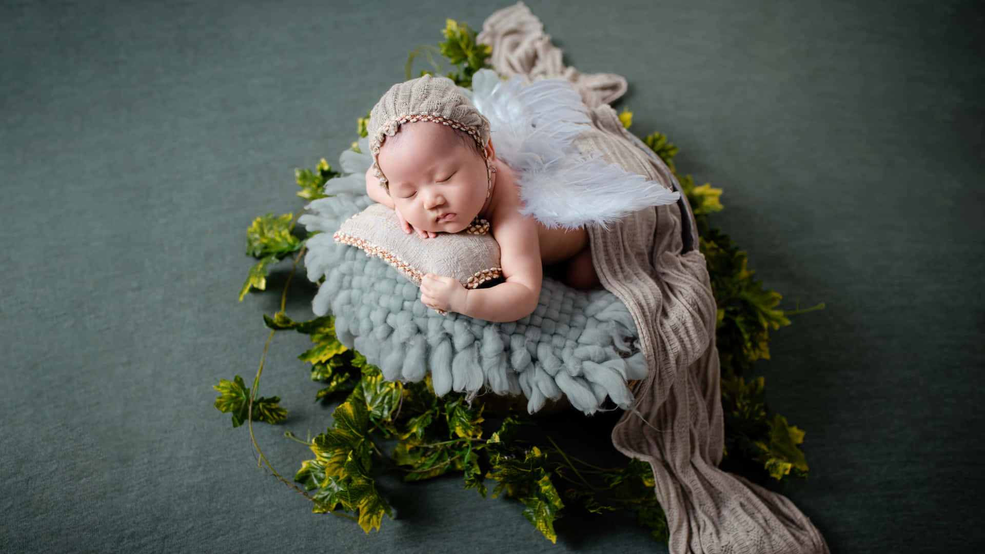 Sleeping Newborn Baby During A Photo Shoot Wallpaper