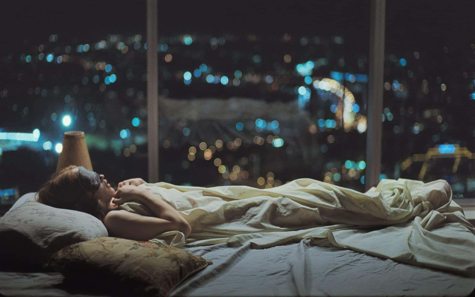 Sleeping On A Room On Top Of A Building Wallpaper