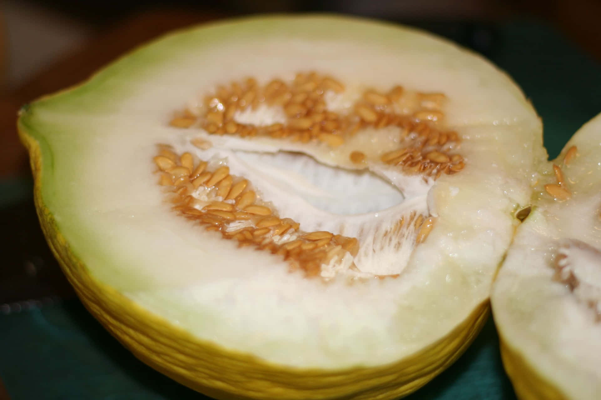 Sliced Casaba Melon Fruit With Seeds Wallpaper