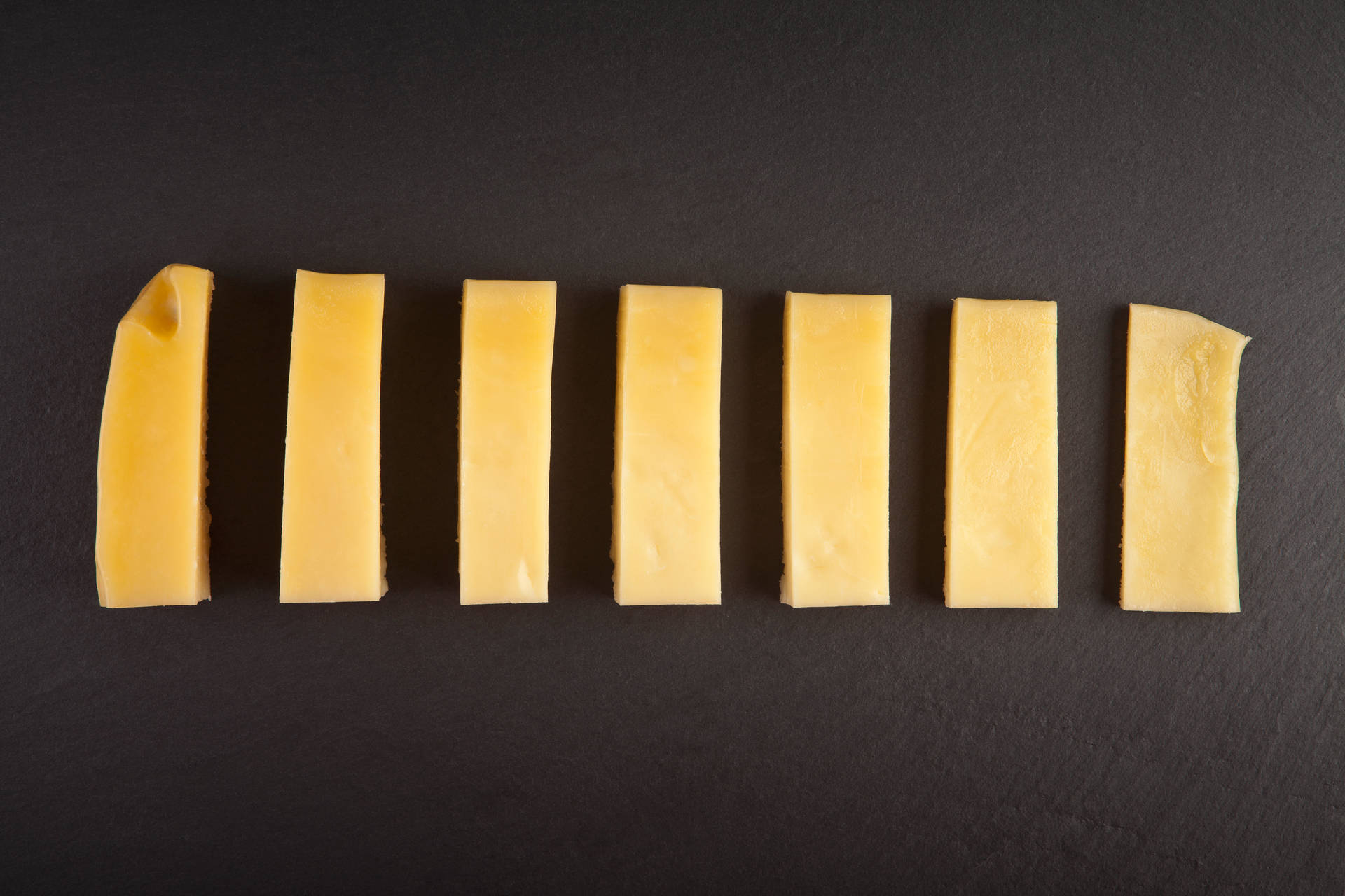 Assorted Sliced Cheese Blocks Wallpaper
