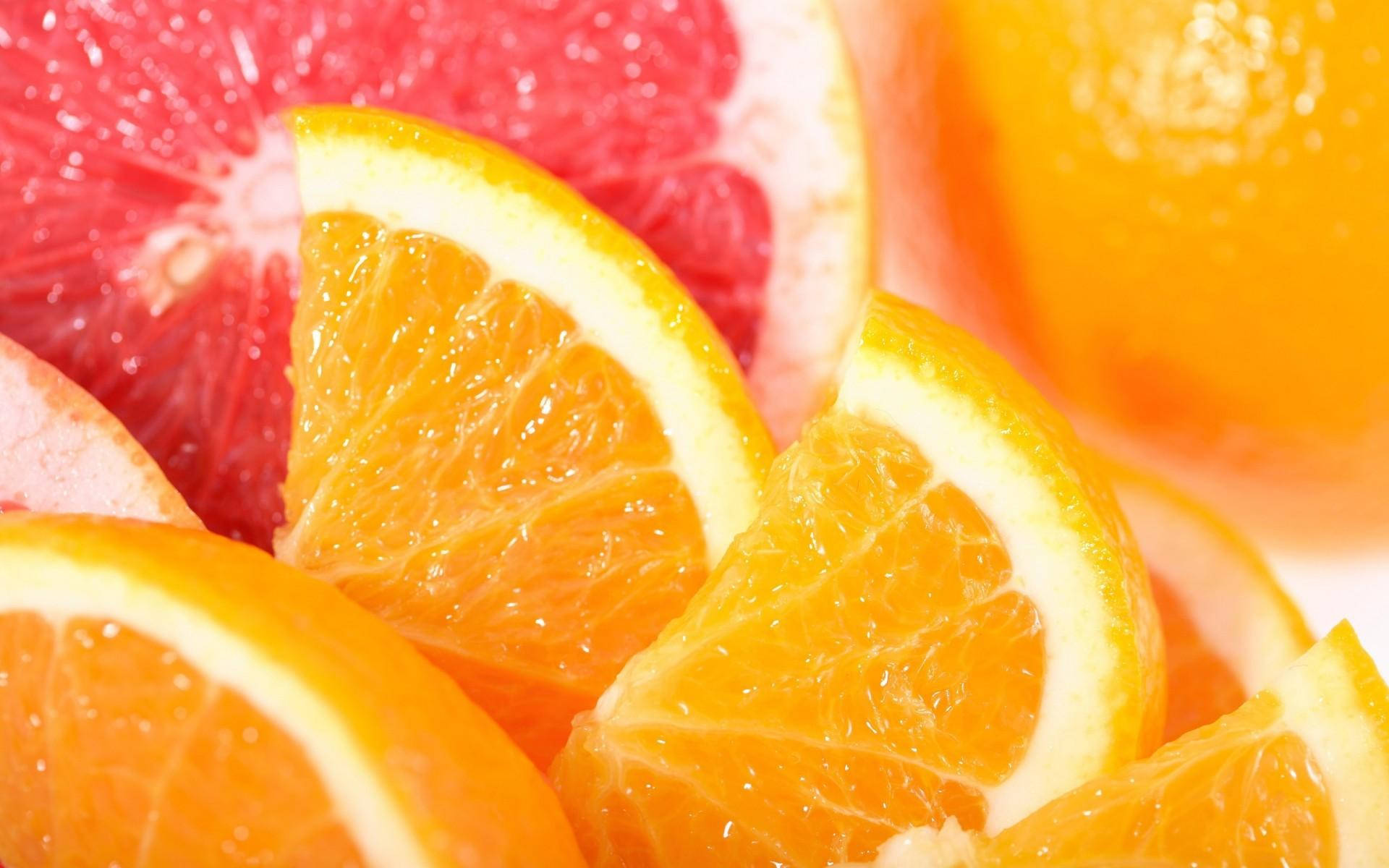 Bright and Fresh Sliced Citrus Fruits - Grapefruits and Oranges Wallpaper