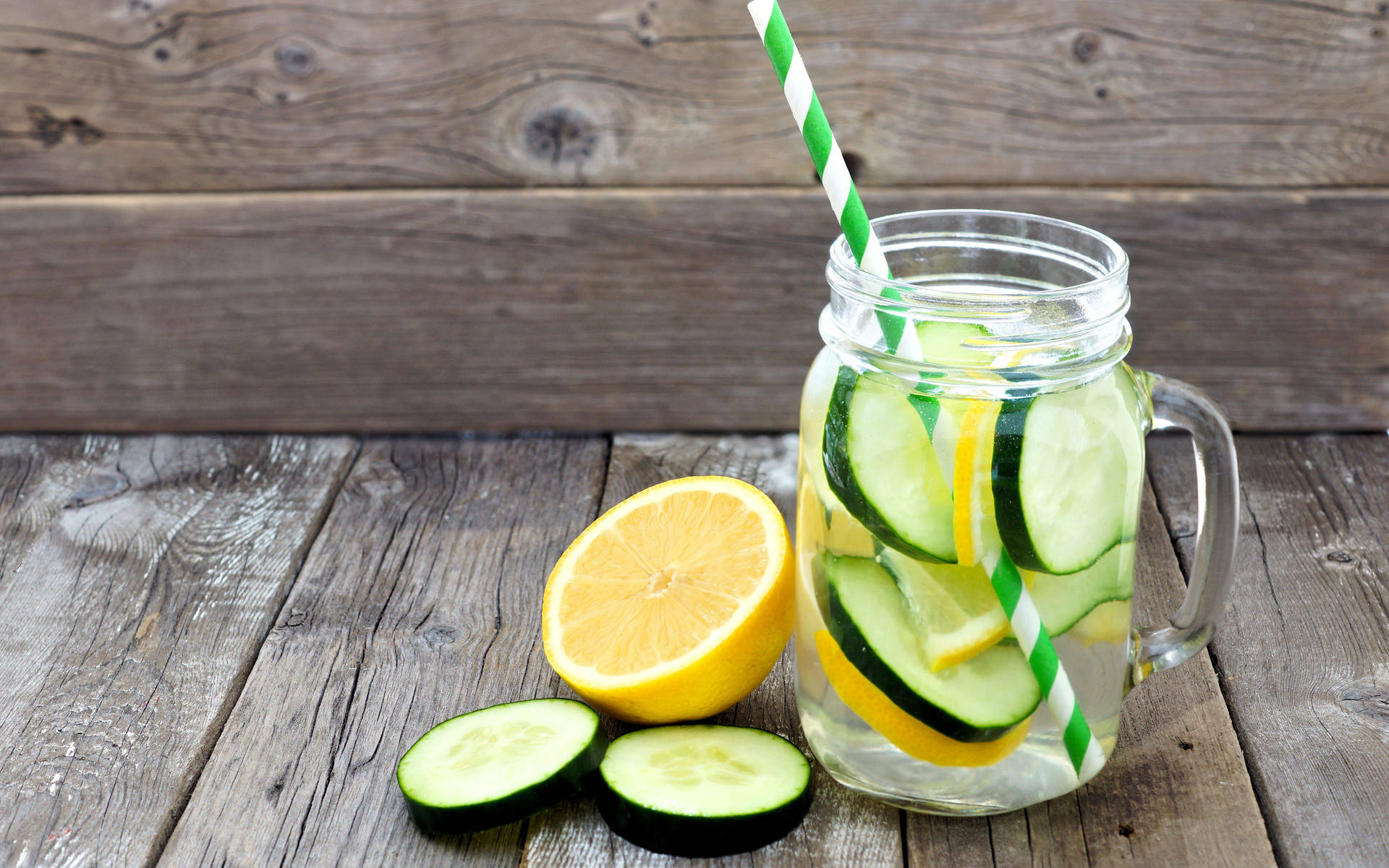 Sliced Cucumber And Lemon Drink In A Jar Wallpaper