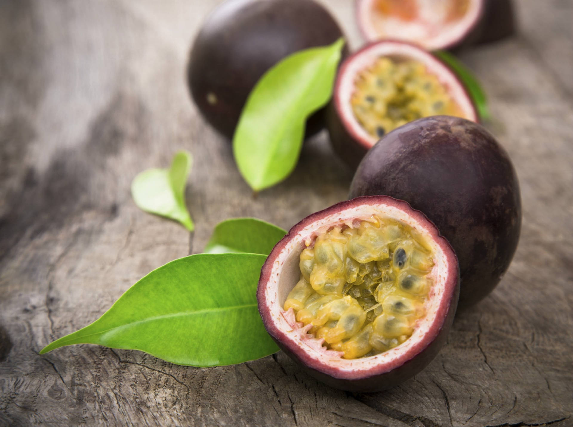 Sliced Open Fresh Passion Fruit Lined Up Wallpaper