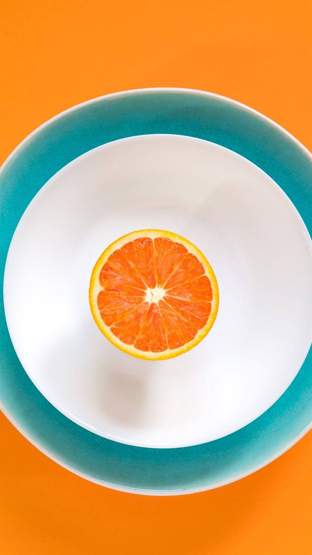 Sliced Orange Fruit On Plate
