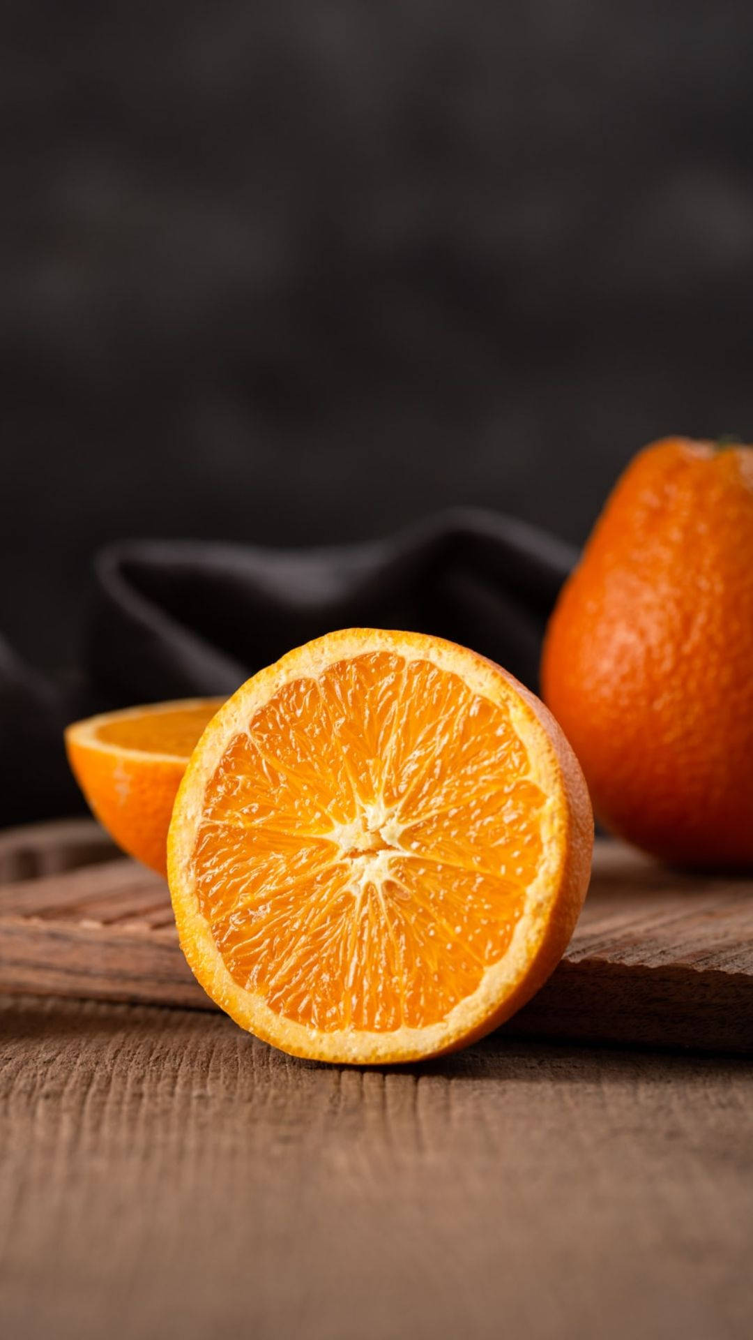 Sliced Orange Fruit On Wood
