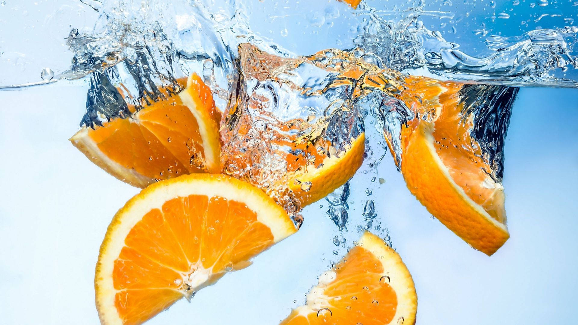 Sliced Orange Fruits Deep In Water