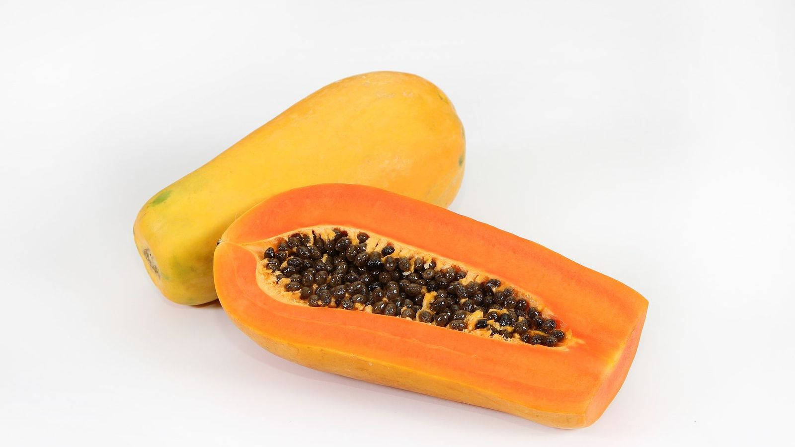 Sliced Papaya Fruits With Seeds White Wallpaper