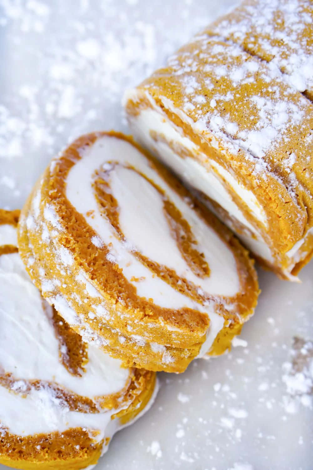 Sliced Pumpkin Roll Dustedwith Powdered Sugar Wallpaper