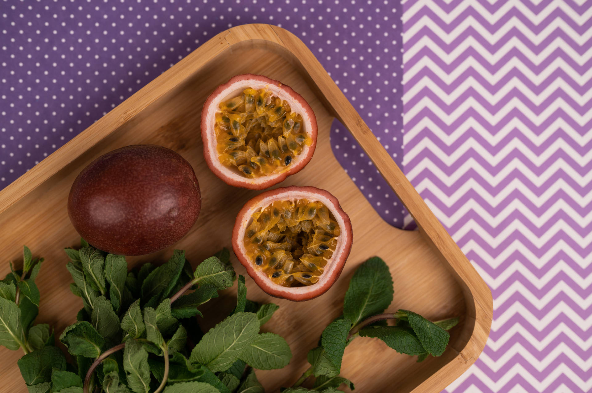 Sliced Ripe Passion Fruit With Leaves Wallpaper