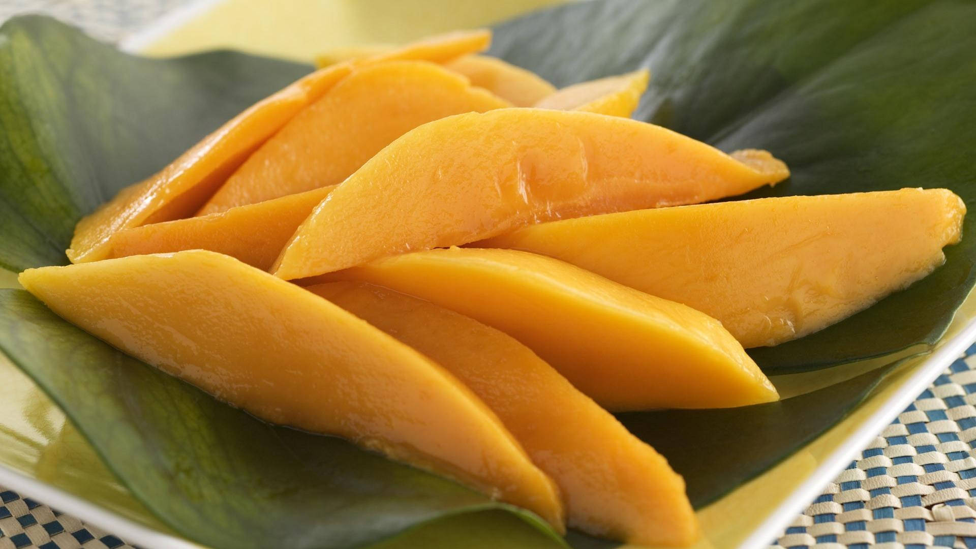 "Fresh Slices of Ripe Mango Ready to Be Enjoyed" Wallpaper
