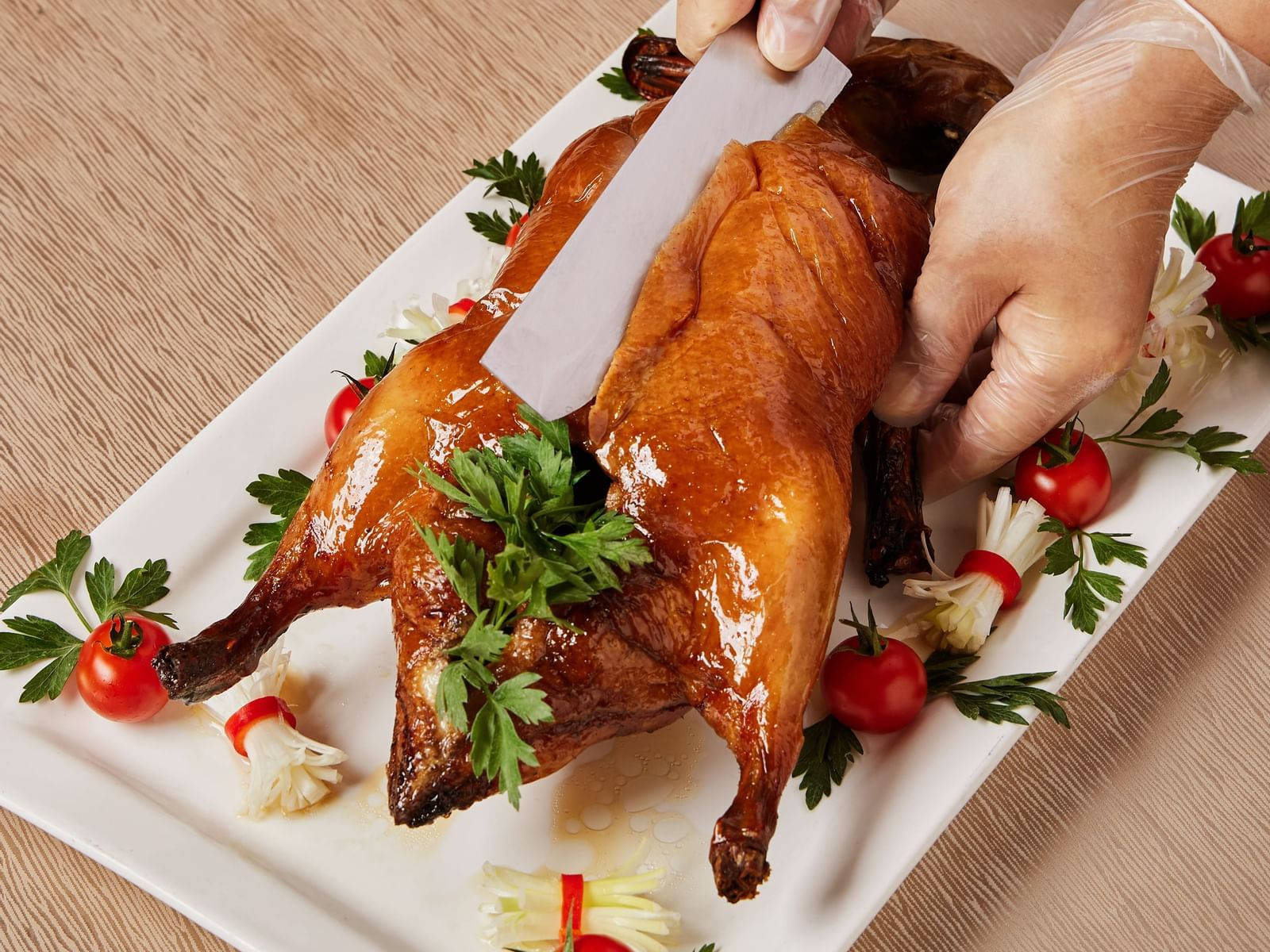 Slicing A Whole Roasted Peking Duck Wallpaper