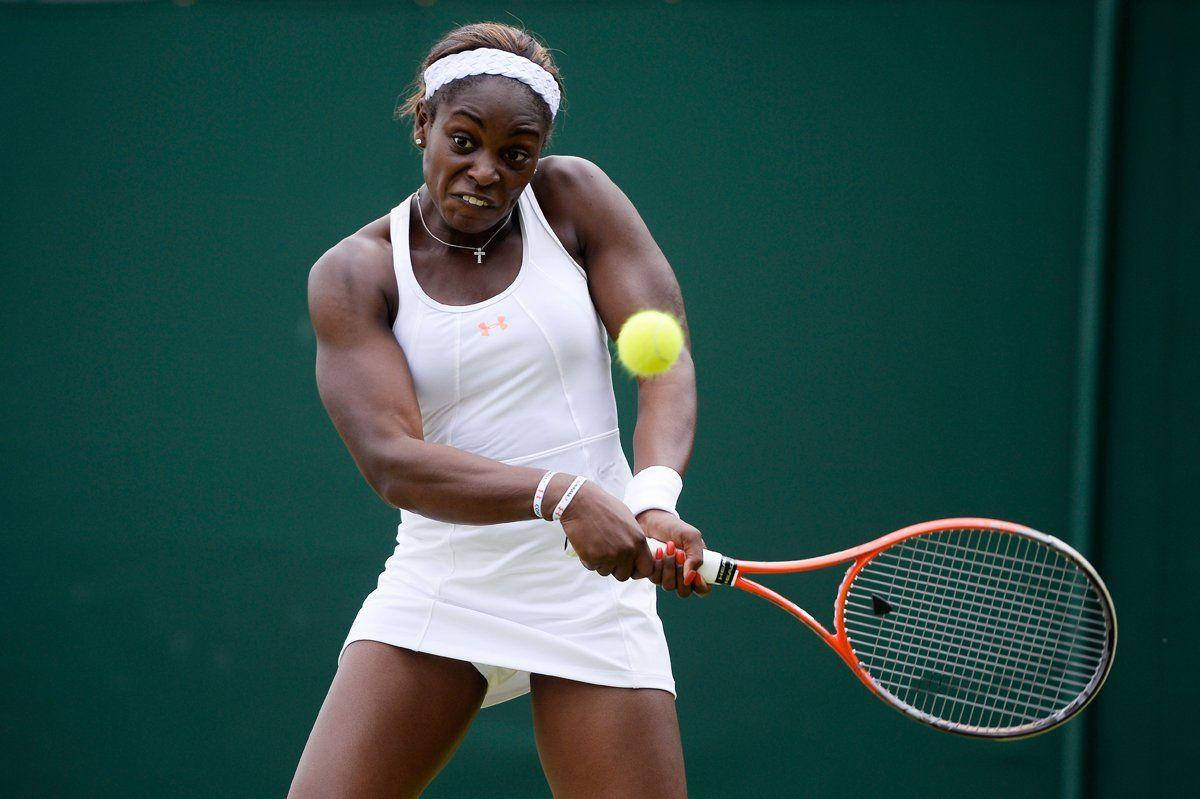 Professional tennis player, Sloane Stephens, in action with both hands on racket Wallpaper