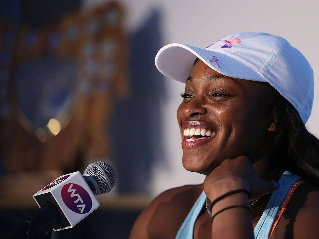 "An Relaxing Interview Moment Capturing a Bright Smile of Tennis Pro Sloane Stephens" Wallpaper