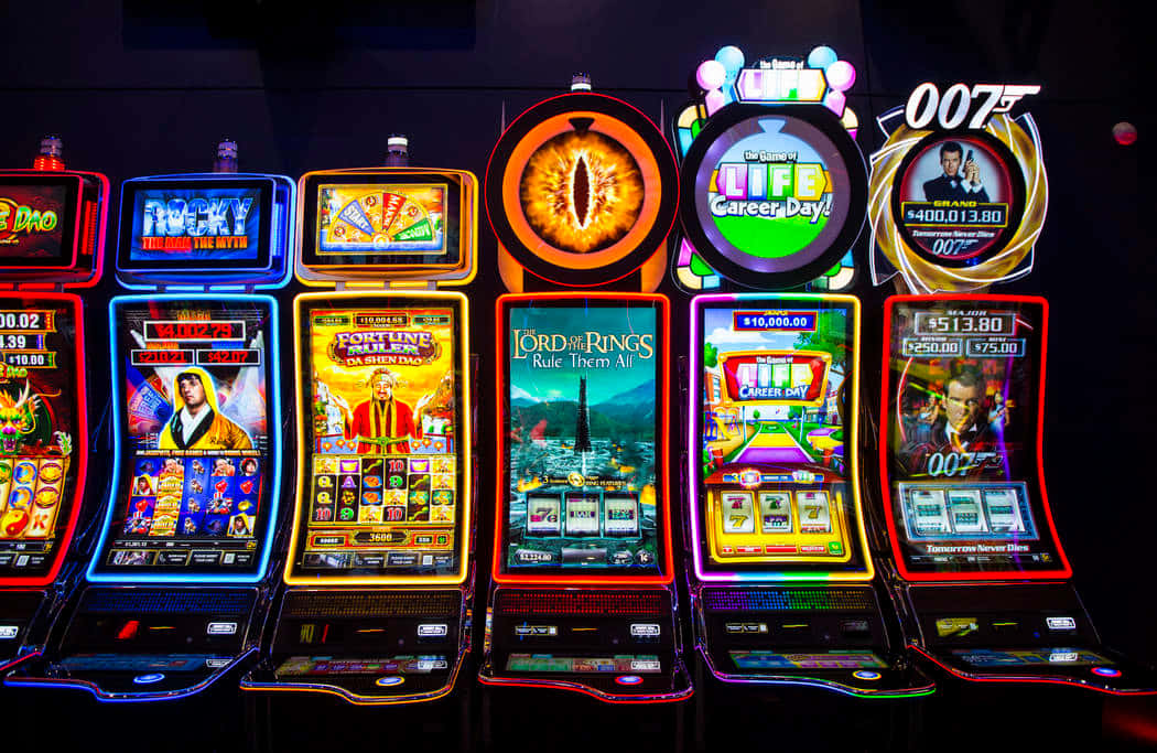 A Row Of Slot Machines In A Casino