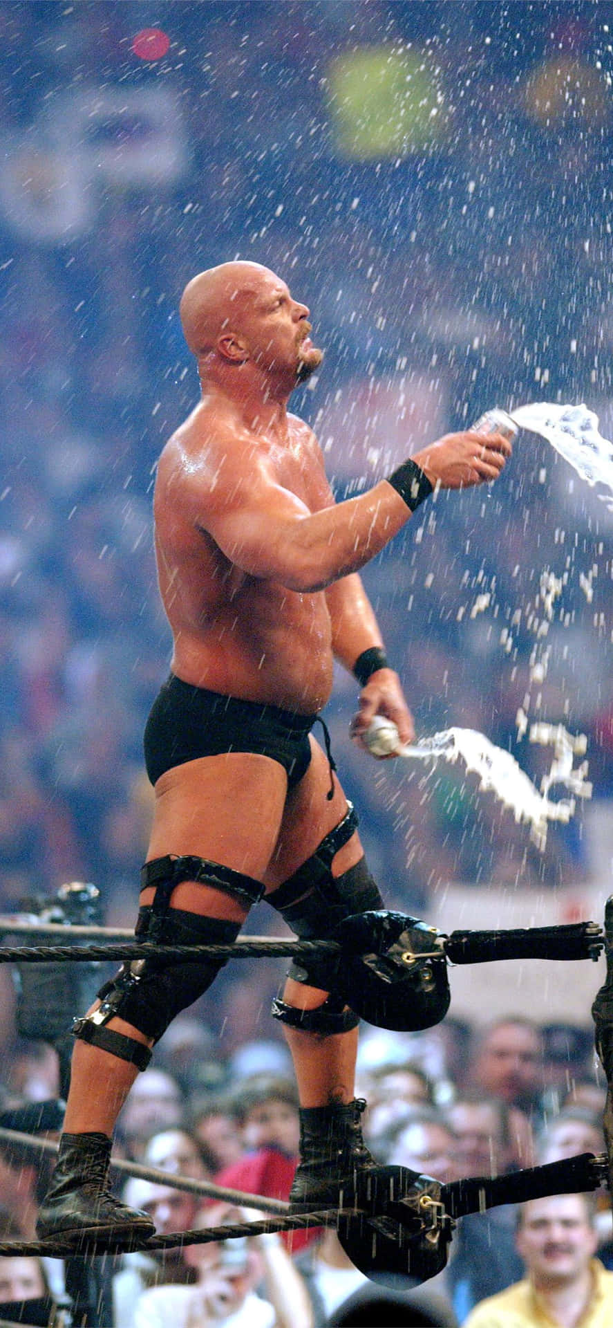 A Wrestler Is Spraying Water On A Crowd Wallpaper
