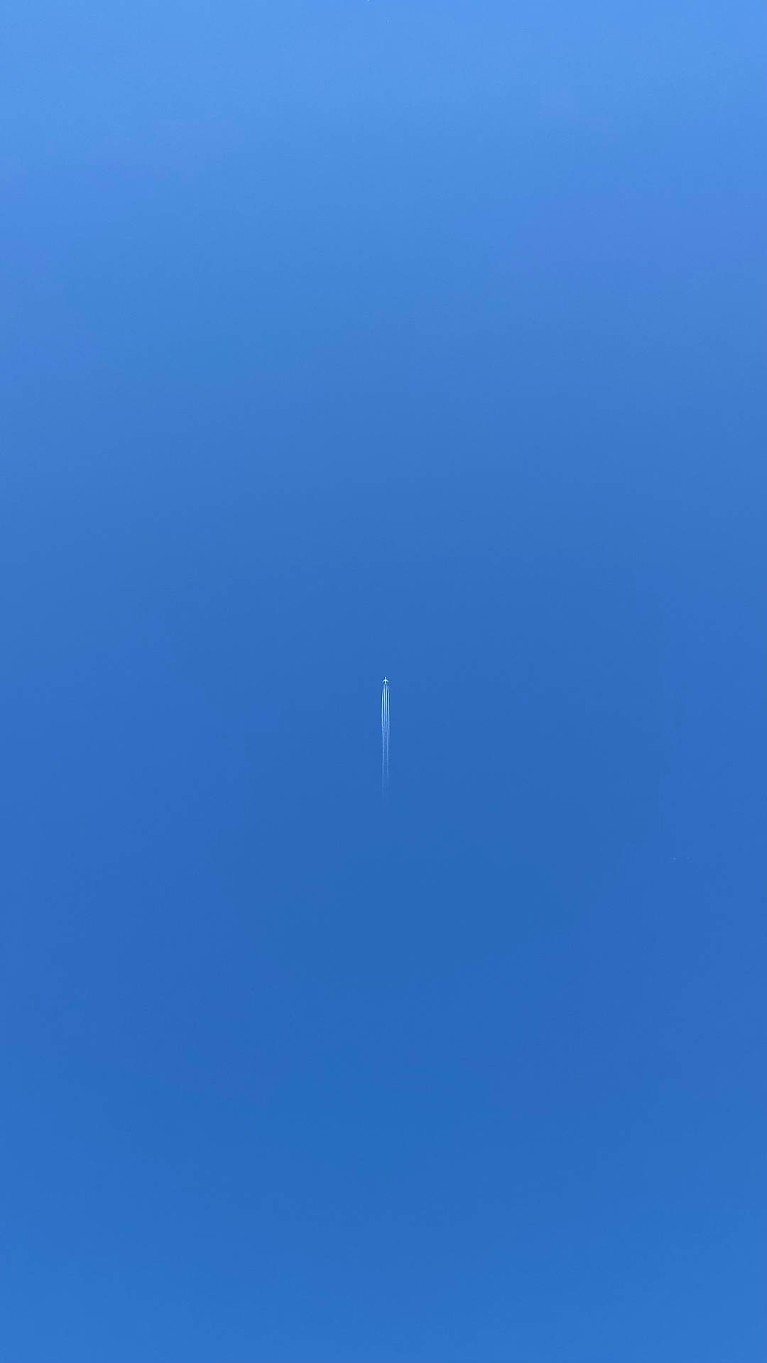 A Small Plane Trails a Ribbon of Cloudy Vapor in the Sky Wallpaper