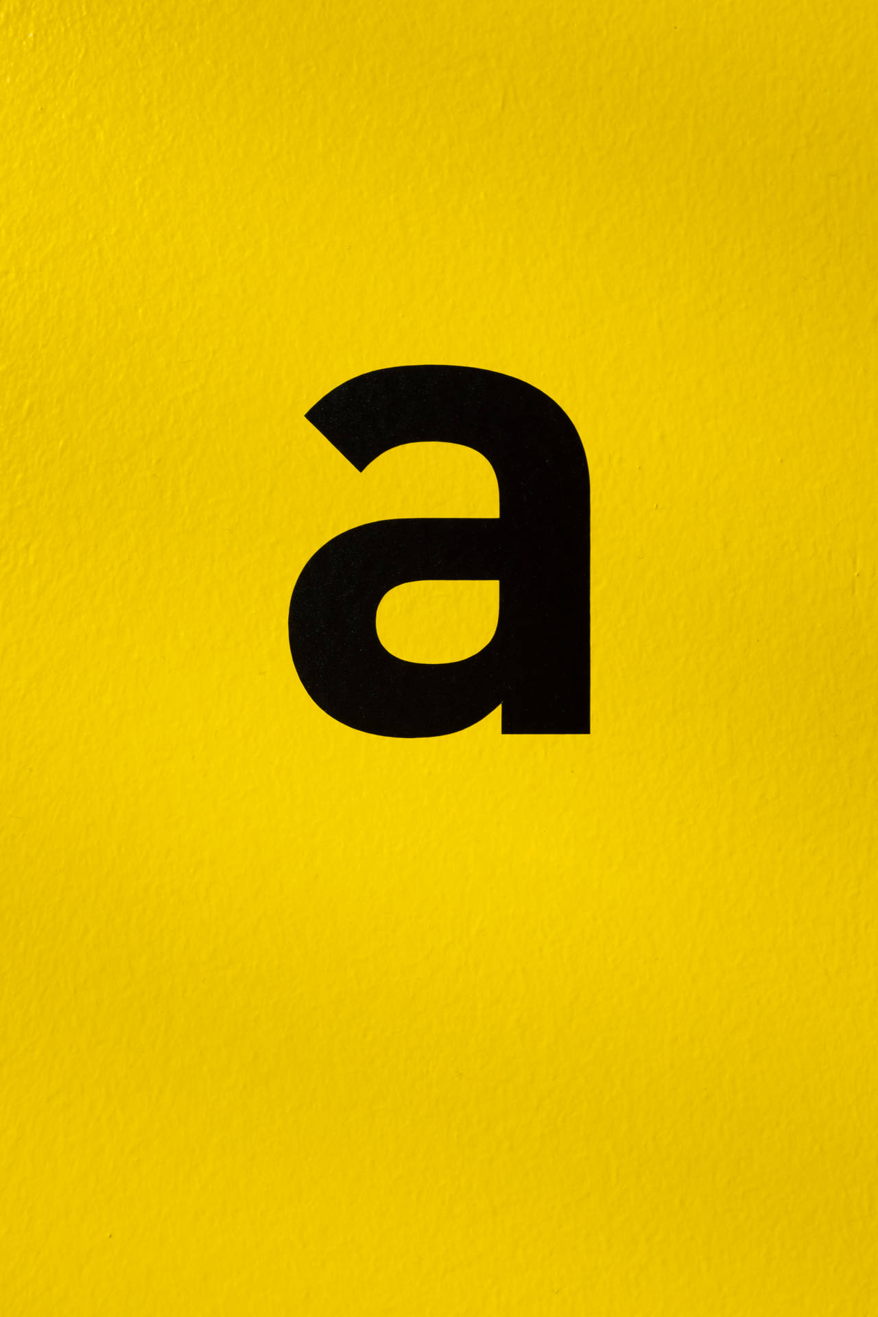 Small Letter A Font On Yellow wallpaper