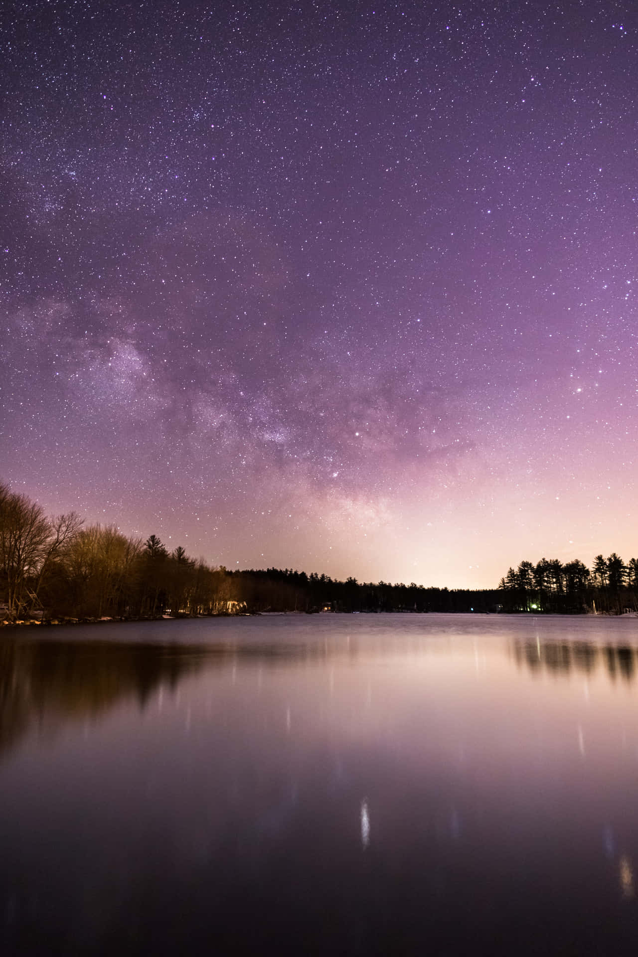 A Lake With Trees And Stars In The Sky Wallpaper