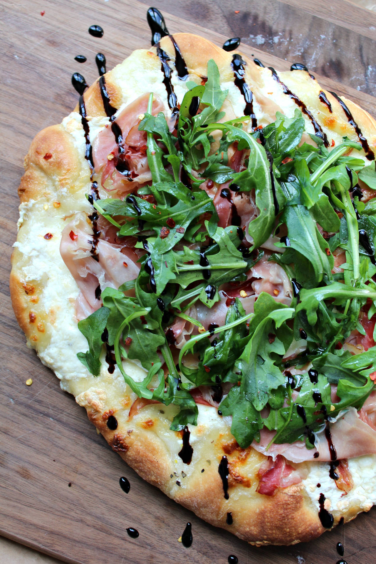 Small Pizza With Meat And Arugula Wallpaper